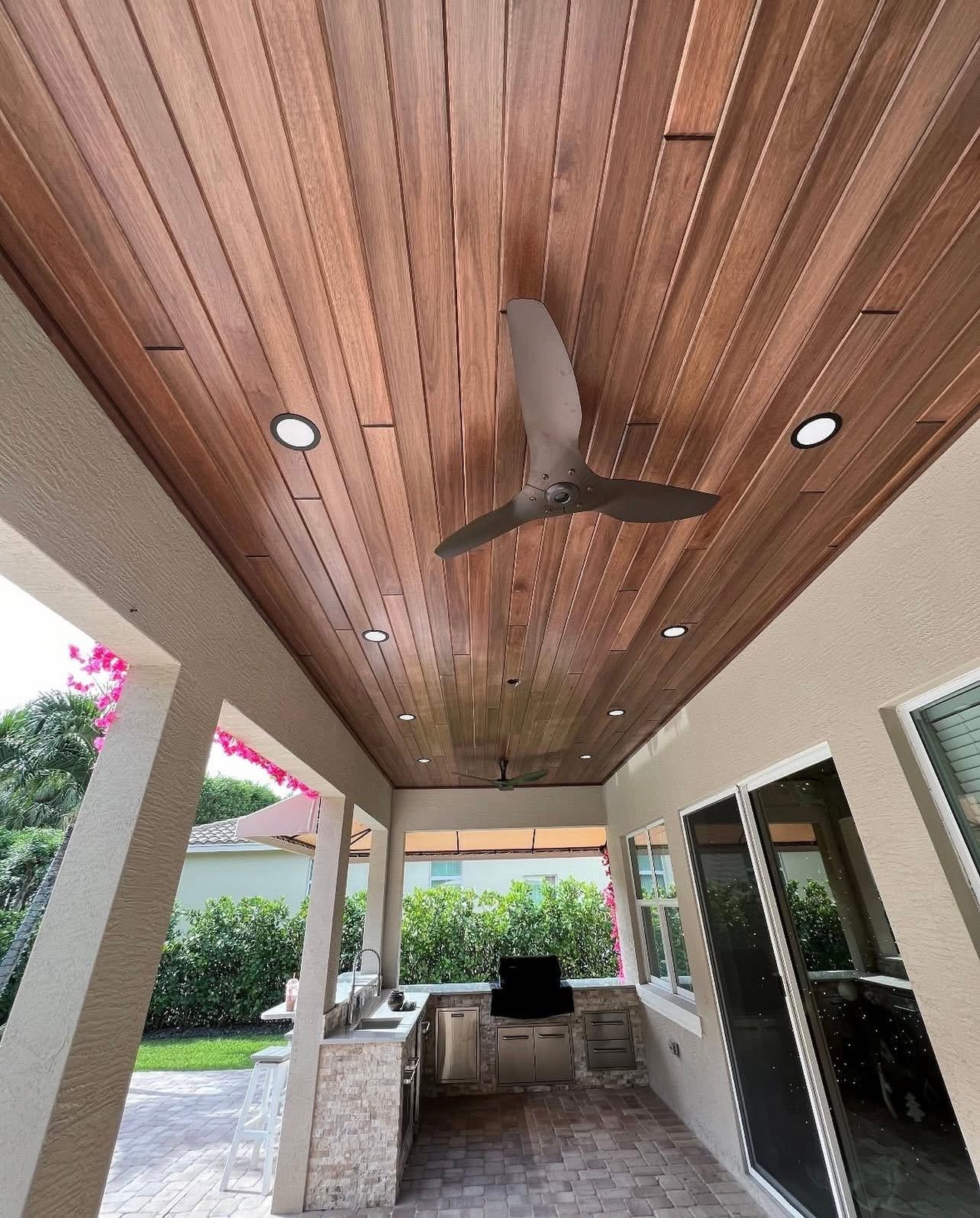 Tongue-and-groove wood ceiling over outdoor kitchen